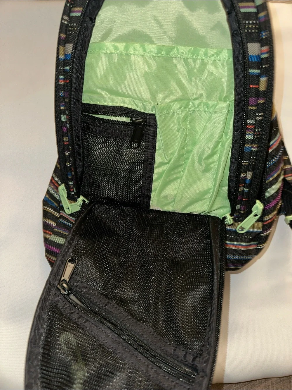 Dakine women’s Striped Backpack in Black, Blue, Purple, Green